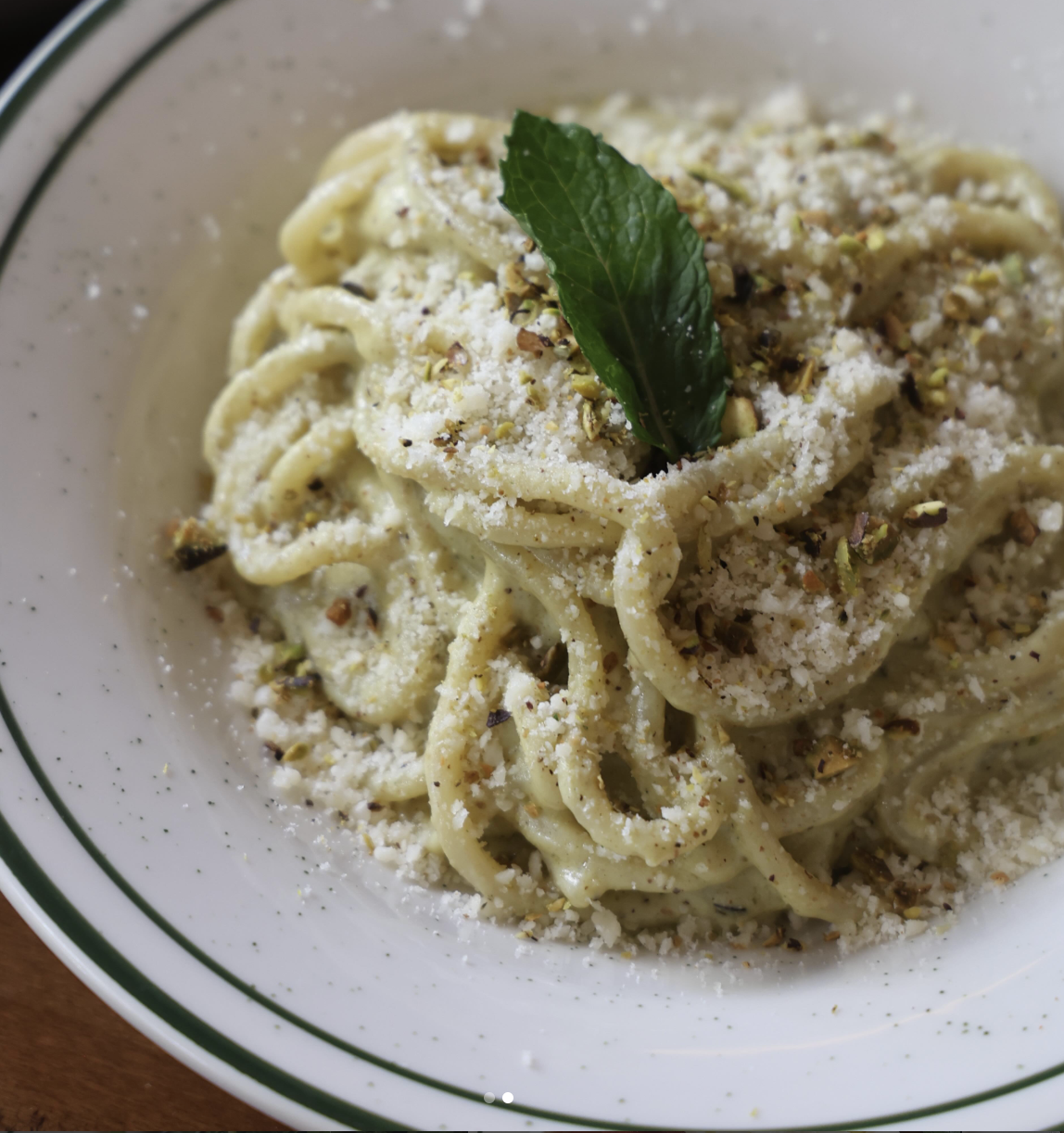 Close-up of fresh Bigoli with pistachio pesto