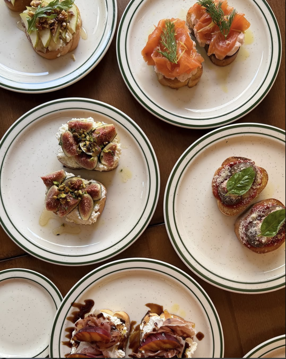 A table spread of Bicchiere cicchetti plates